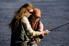 Fishing, fly casting for trout in the North Platte River. MR